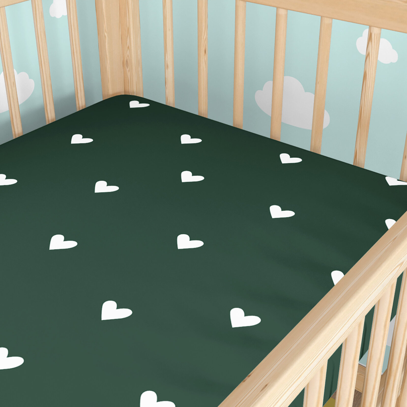 Katoenen hoeslaken voor een babybedje - Hartjes op donkergroen